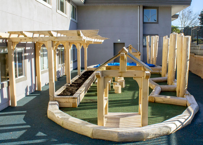Hilltop Natural play space with playhouse