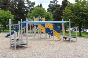 blue and silver playground on woodchip surfacing