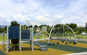 silver and blue playground on rubber surfacing
