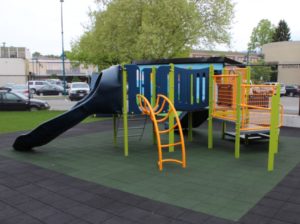 blue and green playground on rubber surfacing