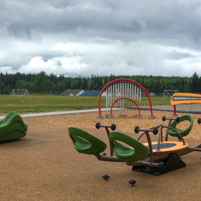 Immaculate Conception park playground with an Omnispin and We-saw