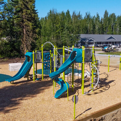 green and blue playground on wood surfacing