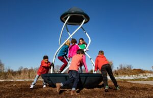 Spinning playground component with children