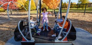 Accessible swing with child in wheelchair