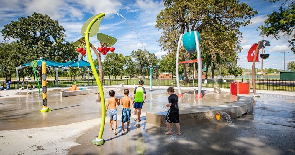 splash pad design with colourful posts and kids playing