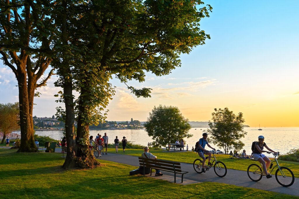 People cycling on waterfront park