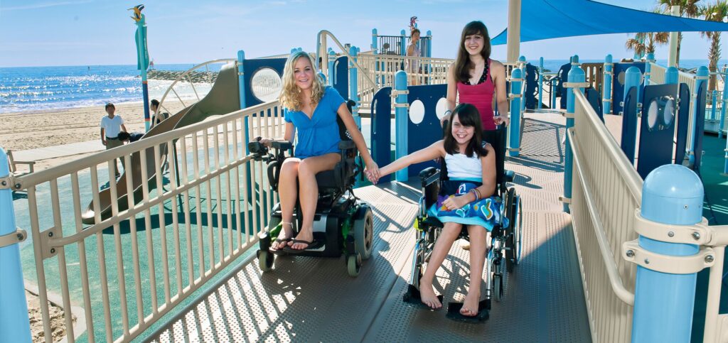 Women and Child in wheelchair holding hands