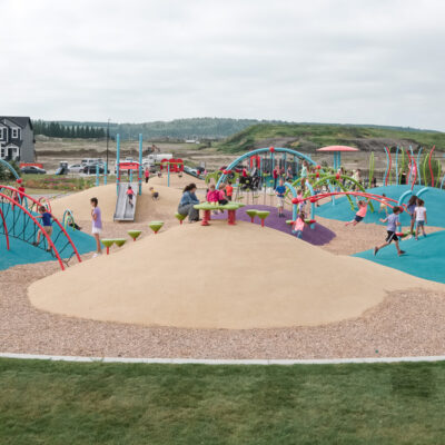 colourful playground on mounded poured-in-place rubber surfacing