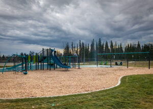 Blue playground with slide and swings