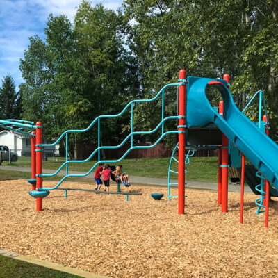 Playground with slide and climbing structure