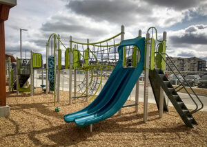 Blue and green playground with Double Swoosh slide