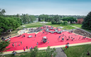 Inclusive playground design with red rubber surfacing