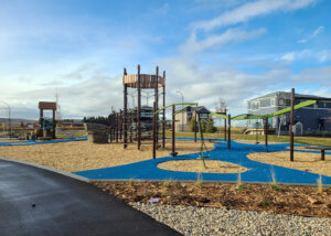 Playground with climbing structure and zipline