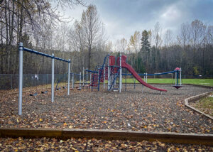 Playground structure with swings