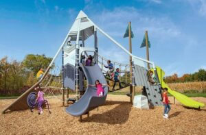Mountain themed playground with children playing