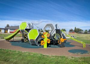 Futuristic silver, green, and tangerine playground on PIP rubber surfacing