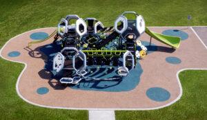 Futuristic silver and green playground on PIP rubber surfacing