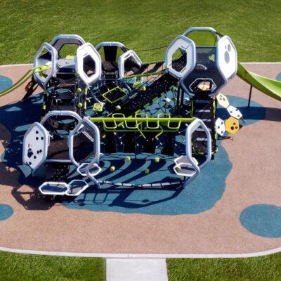 Futuristic silver and green playground on PIP rubber surfacing