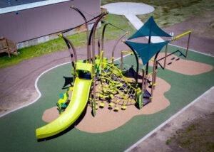 Aerial photo of brown and green playground on PIP rubber surfacing