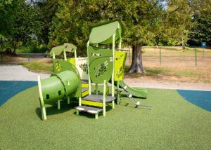 green playground on rubber surfacing