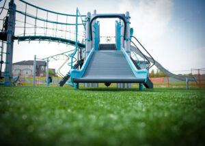 blue and silver playground on turf