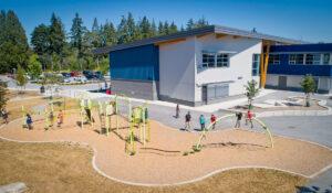 green and silver playground on woodchip surfacing