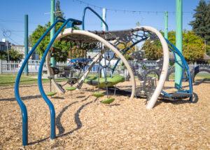 blue and silver playground on woodchip surfacing