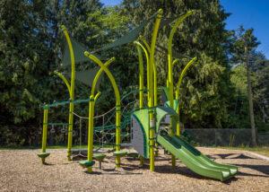 green playground on woodchip surfacing