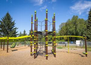 brown and green playground on woodchip surfacing