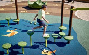 brown and green playground on rubber surfacing
