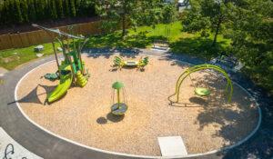 sprout inspired green playground on wood chips