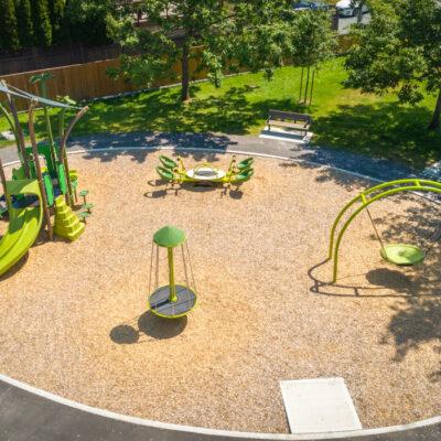 sprout inspired green playground on wood chips