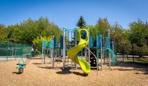 silver blue and green playground on woodchips