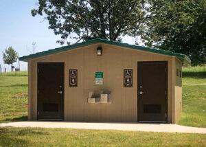 Single user flush washroom building in a park