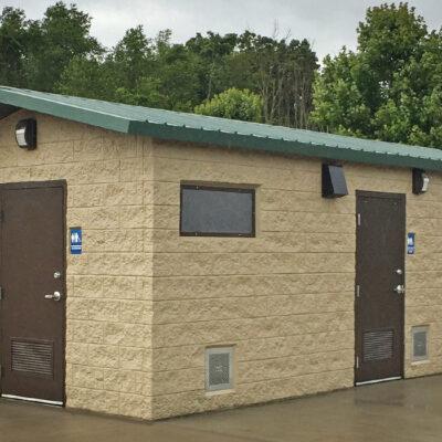 washroom building with Split face block walls wtih cedar shake roof