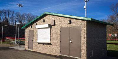 concession stand with Split face block walls with cedar shake roof