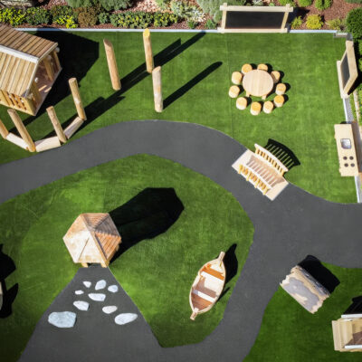 wooden playground on artificial turf & pour-in-place (PIP) rubber surfacing