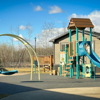 Blue and Yellow playground on rubber surfacing
