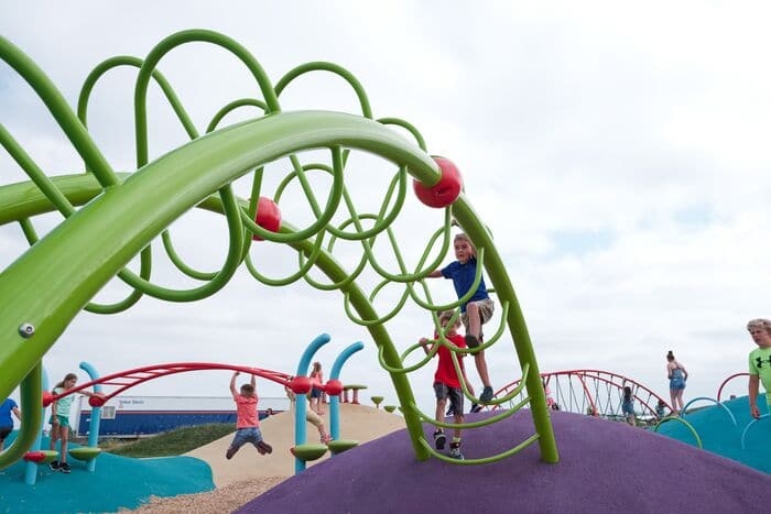 a climber stretching between to rubber mounds