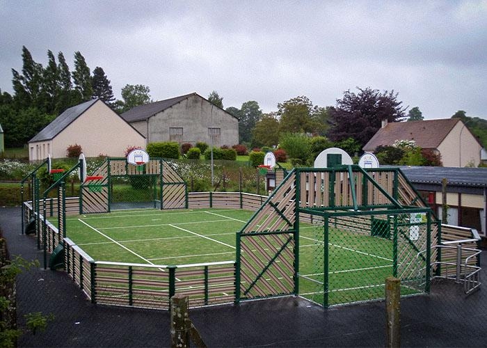 grass sports court with a track around it