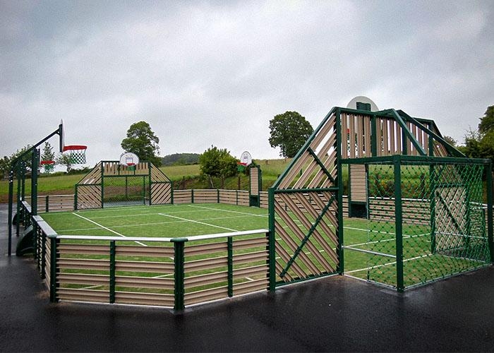 grass sports court with a track around it