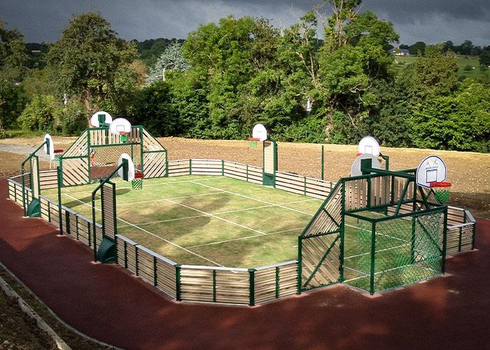 grass sports court with a track around it