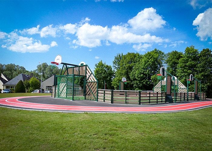 grass sports court with a track around it