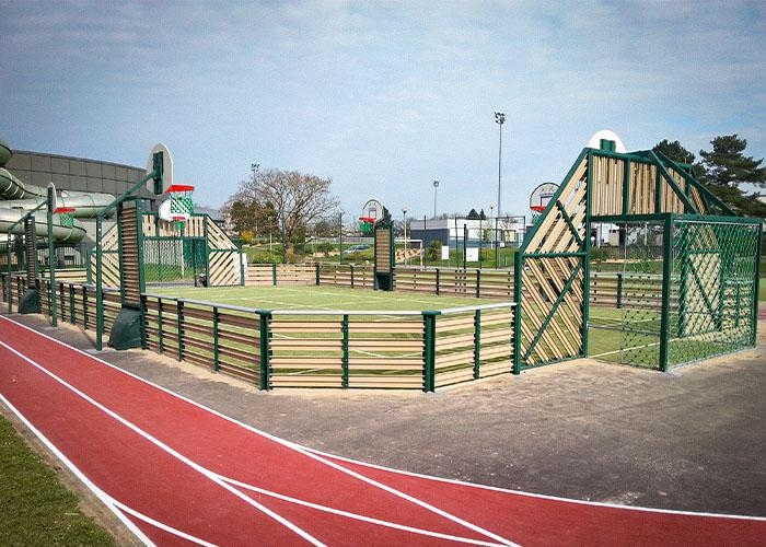 grass sports court with a track around it
