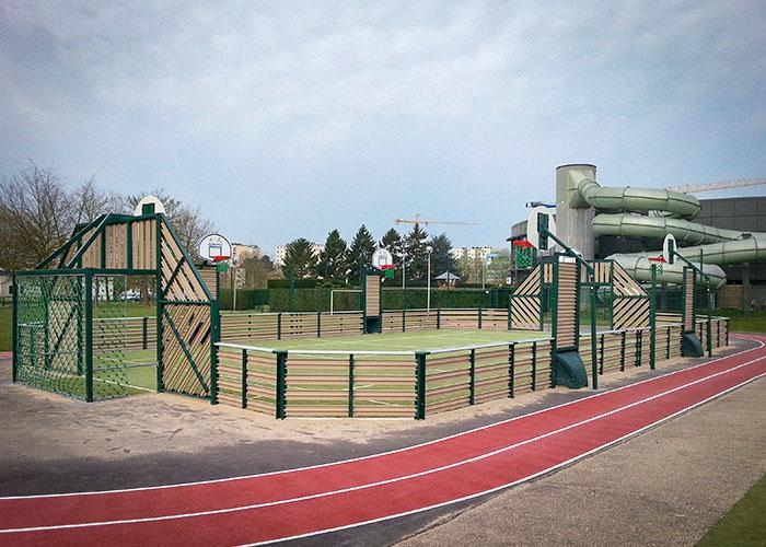 grass sports court with a track around it