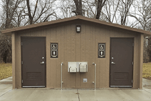 washroom building with Barnwood walls with cedar shake roof