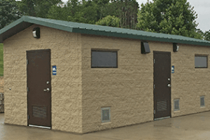 washroom building with Split face block walls wtih cedar shake roof
