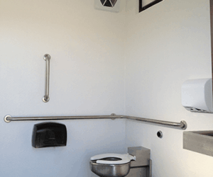 washroom building with Board and batt upper walls, napa valley rock lower walls with cedar shake roof