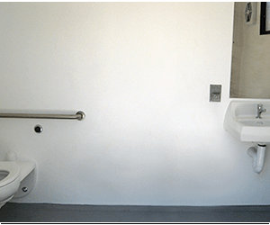 washroom building with Split face block walls wtih cedar shake roof