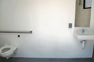 washroom building with Split face block walls wtih cedar shake roof